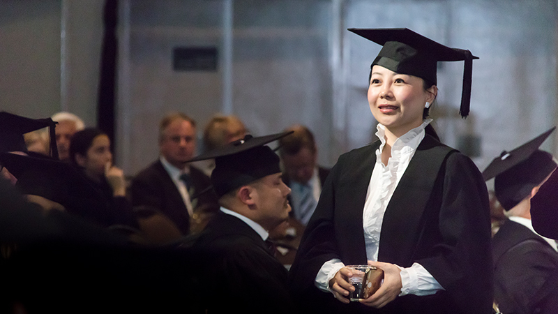  An alumna at a graduation ceremony.