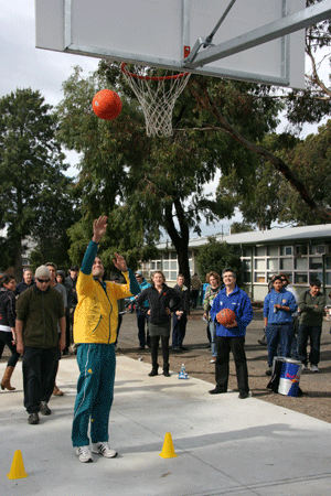 Dennis Iverson shoots a basket