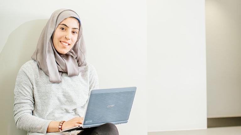  A student using a laptop at VU's St Albans campus.