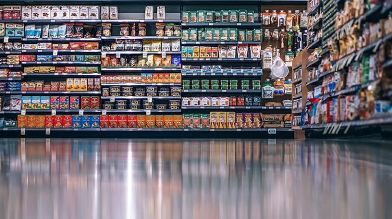 Supermarket aisle shows packaged produce