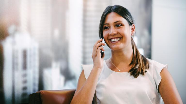 professional looking woman on the phone in business office