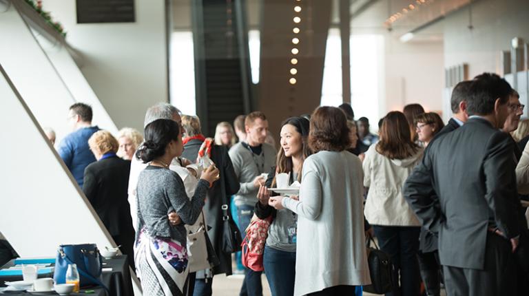 Career practitioners talking during a forum break