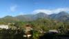  Hills, green landscape and buildings in East Timor