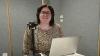 Lisa Higgins with her computer and microphone