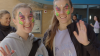  Two young women with painted faces at Open Day 2022