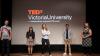 TEDX participants in front of a TEDX Victoria University screen