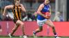 Bulldogs player on the field during a match, runs with the ball