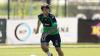 Josh risdon running towards a ball