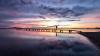  sunset, jetty, person in the distance
