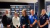 VU sport research experts & industry footy coaches pose for the camera