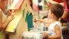 Child painting at preschool