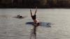 Man falling off a surfboard in Australian lake
