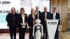 VU staff with robot at Sunshine Skills Hub opening