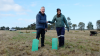  Vice Chancellor Professor Adam Shoemaker and VU Student Tahnee Towers plant the first tree.