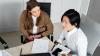  Two law graduates in an office working