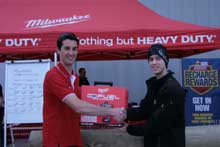 Milwaukee’s Tom Mathiesen congratulates prize winner Christopher Agnew.